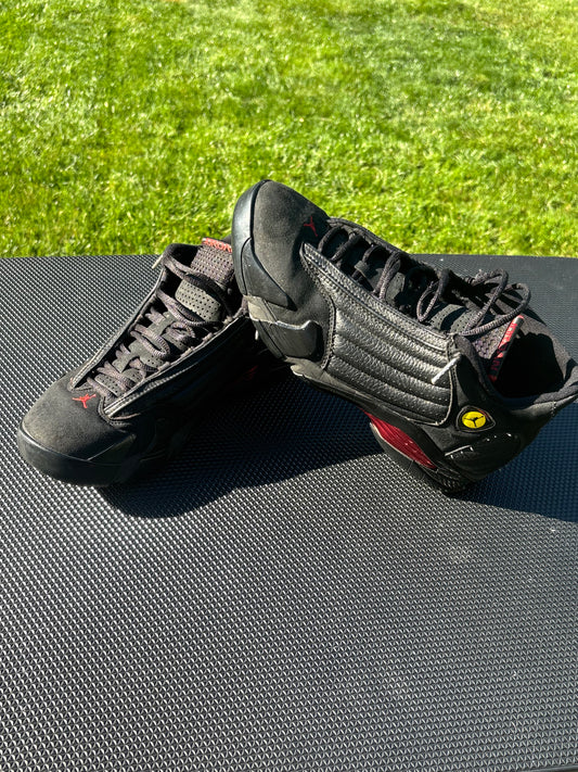 Black leather and suede/nubuck upper with red Jumpman details, Ferrari-inspired shield logo and signature Jordan 14 styling