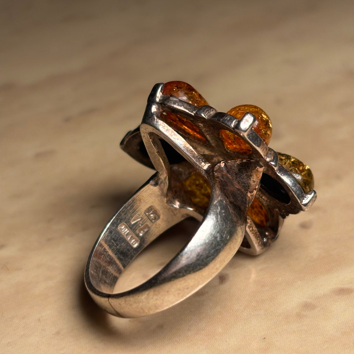 Inside of sterling silver ring band showing the 925, V8, and POLAND hallmarks.
