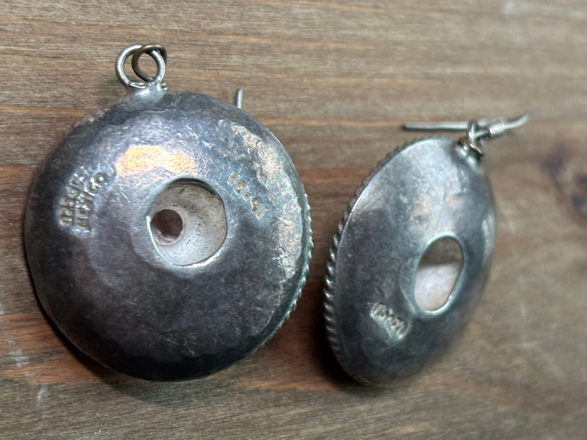 backside view of Mexican sterling silver sombrero earrings showing hollow construction, openings, and stamped markings.