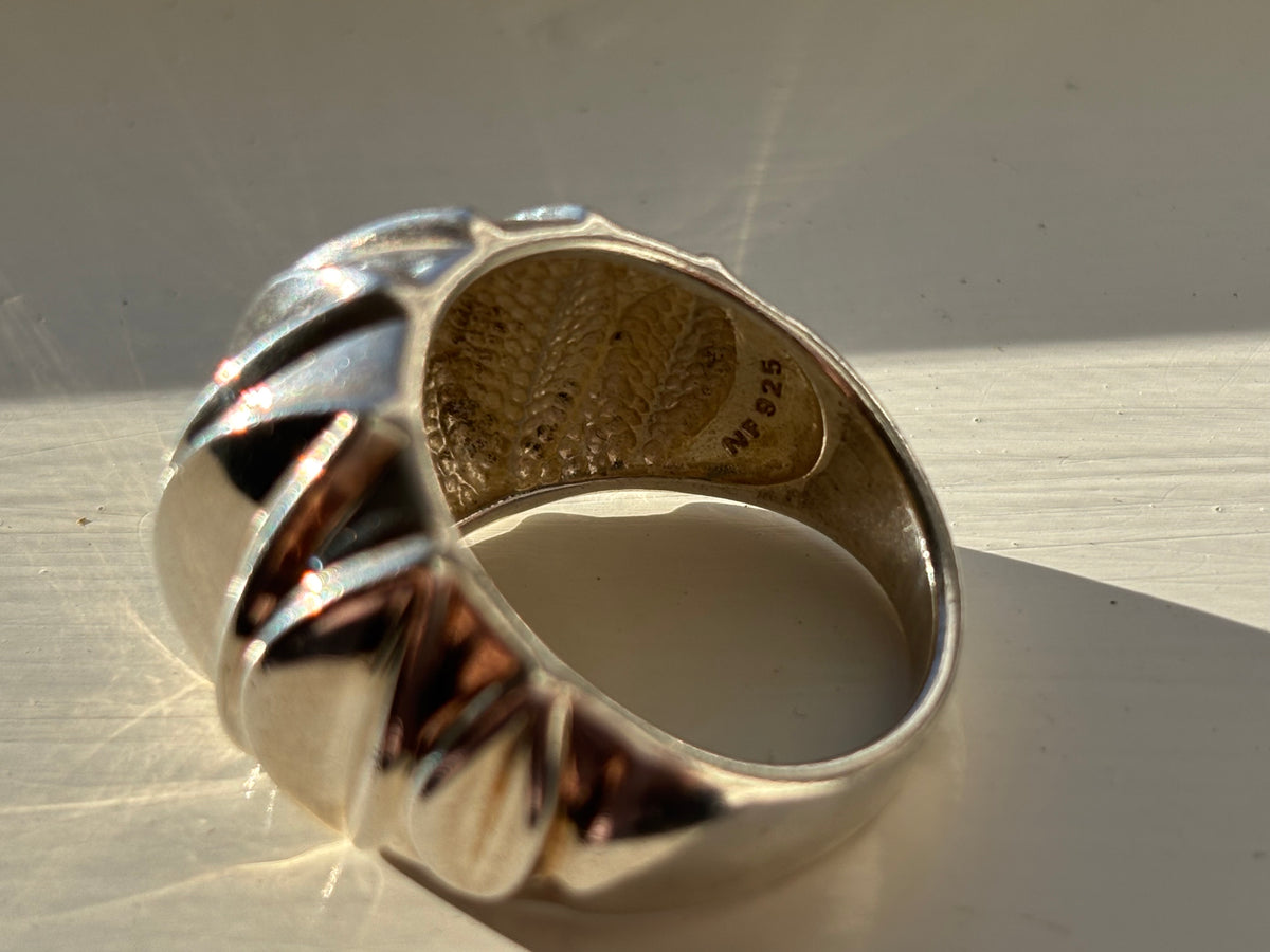 Side view of the ring showing the underside with NF 925 stamped on the inside of the band