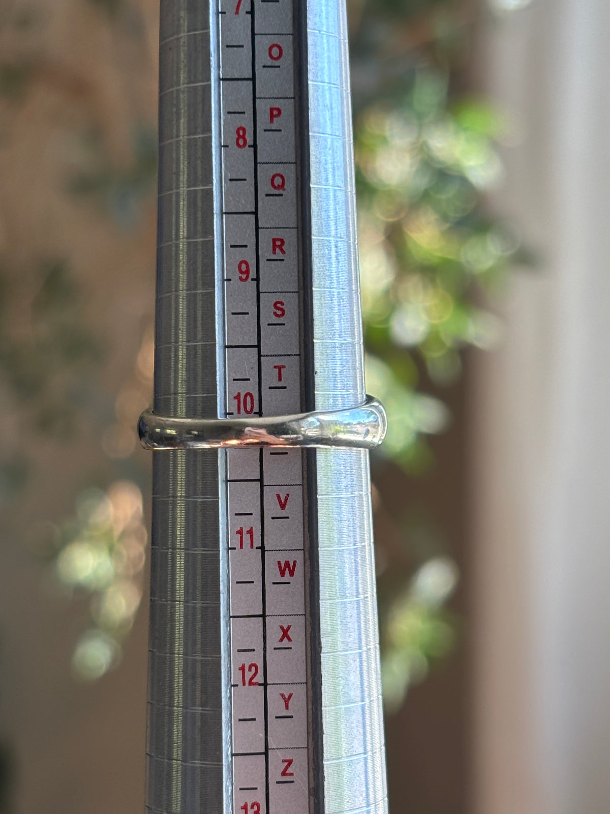 Photo of the ring on a mandrel showing its size at 10.25