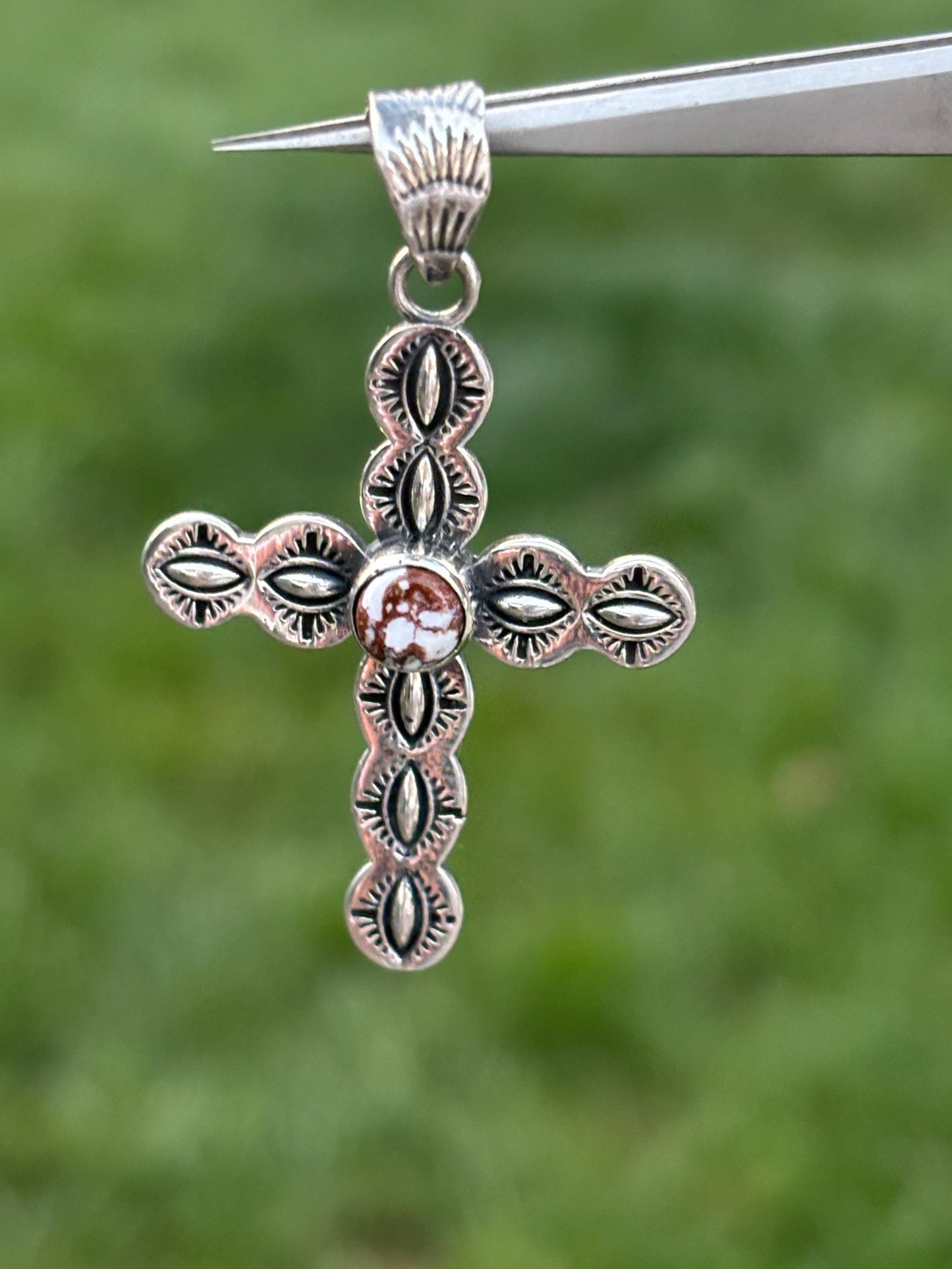 Sterling Silver Cross Pendant with Reddish-Brown Stone & White Matrix